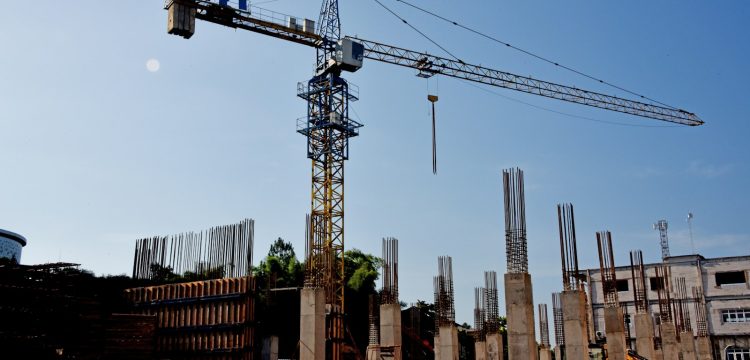 a construction site with a crane in the background