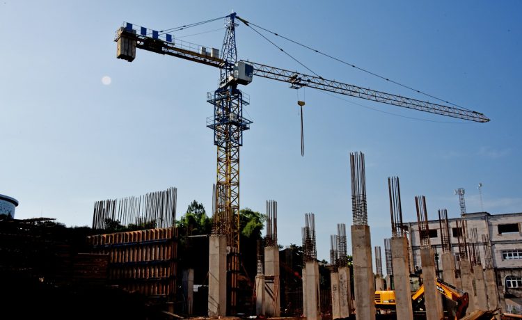 a construction site with a crane in the background